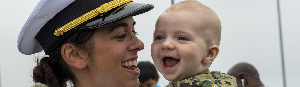 Navy mother holding baby