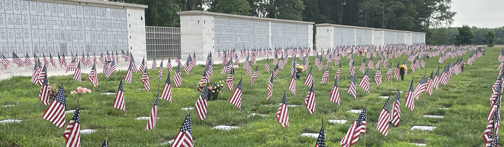 Albert G. Horton, Jr. Memorial Veterans Cemetery columbarium and headstones with flags